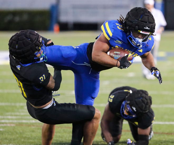 Delaware defensive back Hasson Manning Jr tackles running back Quincy Watson during the Blue and White Spring Game at Delaware Stadium, Friday, April 19, 2024.