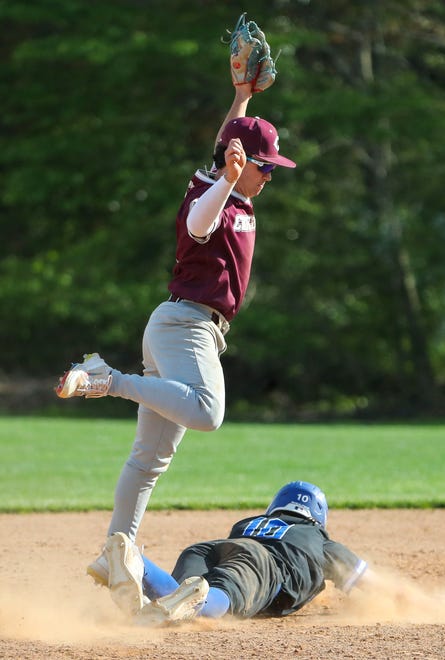 Concord's Andrew Firko leaps over Brandywine's Vince Mazzotta after tagging him out on the basepaths after catching a line drive for a double play in the fifth inning in Concord's 3-1 win at Brandywine High School, Tuesday, April 23, 2024.