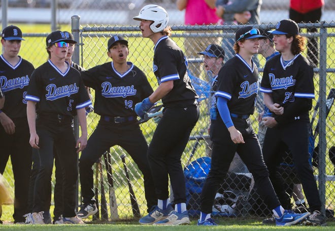 Brandywine's Aidan Kee (center) reacts after scoring to get the Bulldogs on the board in the seventh inning of Concord's 3-1 win at Brandywine High School, Tuesday, April 23, 2024.