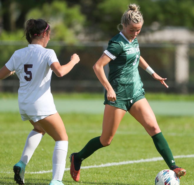 Caravel's Hailey Haynes (left) moves for Saint Mark's Lily Phillips in the first half of the Bucs' 1-0 overtime win at Saint Mark's High School, Wednesday, April 24, 2024.