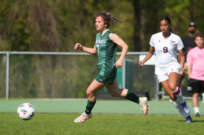 Saint Mark's Brynn Casapulla (left) is followed by Caravel's Anaya Price in the first half of the Bucs' 1-0 overtime win at Saint Mark's High School, Wednesday, April 24, 2024.