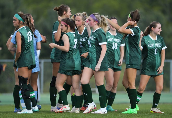 The Saint Mark's side breaks their huddle as they get set for the second half of the Bucs' 1-0 overtime win at Saint Mark's High School, Wednesday, April 24, 2024.