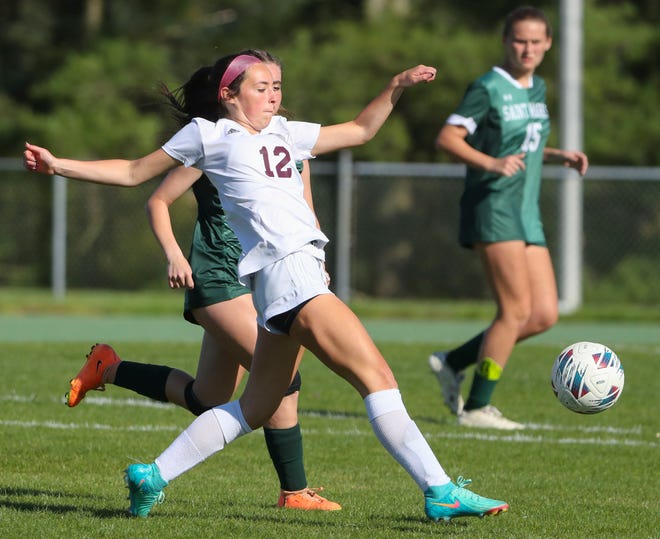 Caravel's Hayden Wynne pushes the ball ahead in the second half of the Bucs' 1-0 overtime win at Saint Mark's High School, Wednesday, April 24, 2024.