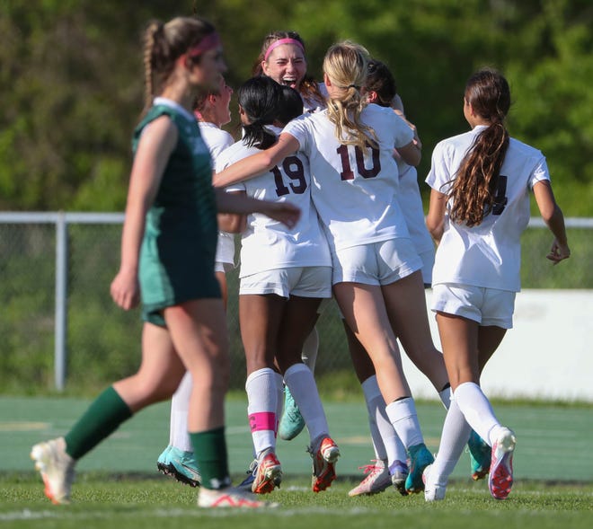 Caravel's Grace Slapcinsky (facing camera) is the center of celebration after her corner kick went in the net for a 1-0 overtime win at Saint Mark's High School, Wednesday, April 24, 2024.
