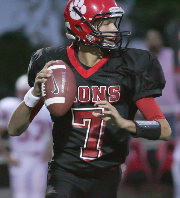 Red Lion starting quarterback, David Sills, looks for room to pass in the 2nd quarter against Smyrna on Sept.10, 2010.