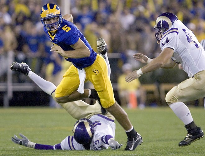 University of Delaware quarterback Joe Flacco (5) slips away from West Chester linebacker Sam Scott before being forced to unload the ball by Ram linebacker Morty Hoery in the second quarter at Delaware Stadium, Saturday, Sept. 8, 2007 in Newark.