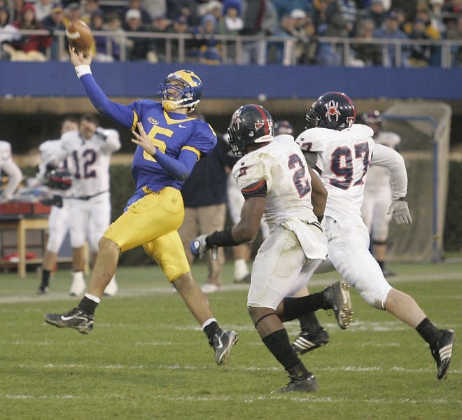 Delaware quarterback Joe Flacco is rushed in his desperation, fourth down throw on the last play of the Blue Hens' five overtime, 62-56 loss by Richmond defensive lineman Lawrence Sidbury, Jr., (2) and Adam Abramowitz at Delaware Stadium in Newark, Del., Saturday, Nov. 10, 2007.