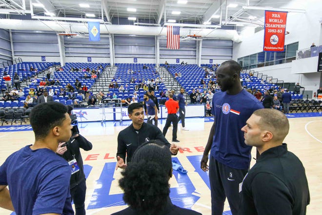 Delaware Bluecoats Guard ZHAIRE SMITH (8) "on NBA Assignment from 76ers" and Maine Red Claws Center TACKO FALL (99) receive instructions from the referees prior to a NBA G-League regular season basketball game between the Bluecoats and the Maine Red Claws (Boston Celtics) Saturday, Nov. 09, 2019, at the 76ers Fieldhouse in Wilmington, DE