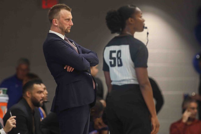 Delaware Bluecoats Head Coach CONNOR JOHNSON watches the game from the bench area in the first half of a NBA G-League regular season basketball game between the Bluecoats and the Maine Red Claws (Boston Celtics) Saturday, Nov. 09, 2019, at the 76ers Fieldhouse in Wilmington, DE
