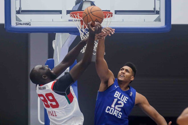 Delaware Bluecoats Center DORAL MOORE (12) blocks Maine Red Claws Center TACKO FALL (99) shot attempt in the first half of a NBA G-League regular season basketball game between the Bluecoats and the Maine Red Claws (Boston Celtics) Saturday, Nov. 09, 2019, at the 76ers Fieldhouse in Wilmington, DE