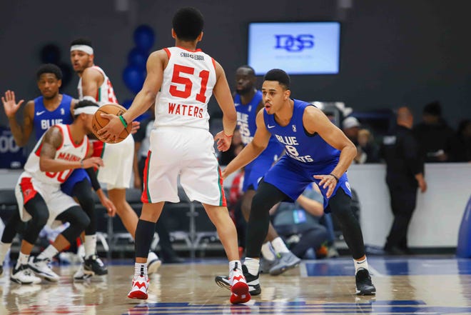 Delaware Bluecoats Guard ZHAIRE SMITH (8) "on NBA Assignment from 76ers" plays defense in the first half of a NBA G-League regular season basketball game between the Bluecoats and the Maine Red Claws (Boston Celtics) Saturday, Nov. 09, 2019, at the 76ers Fieldhouse in Wilmington, DE