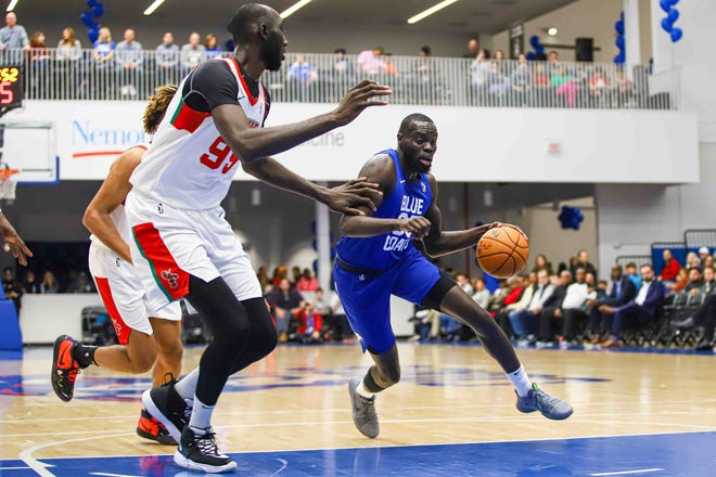 Delaware Bluecoats Guard MARIAL SHAYOK (35) drives to the basket as Maine Red Claws Center TACKO FALL (99) defends in the first half of a NBA G-League regular season basketball game between the Bluecoats and the Maine Red Claws (Boston Celtics) Saturday, Nov. 09, 2019, at the 76ers Fieldhouse in Wilmington, DE