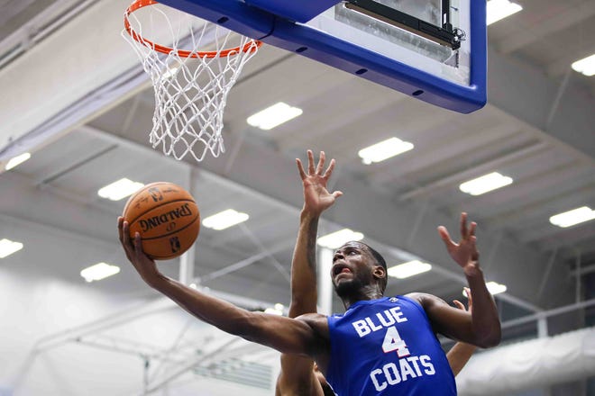 Delaware Bluecoats Forward JULIAN WASHBURN (4) drives to the hoop in the first half of a NBA G-League regular season basketball game between the Bluecoats and the Maine Red Claws (Boston Celtics) Saturday, Nov. 09, 2019, at the 76ers Fieldhouse in Wilmington, DE