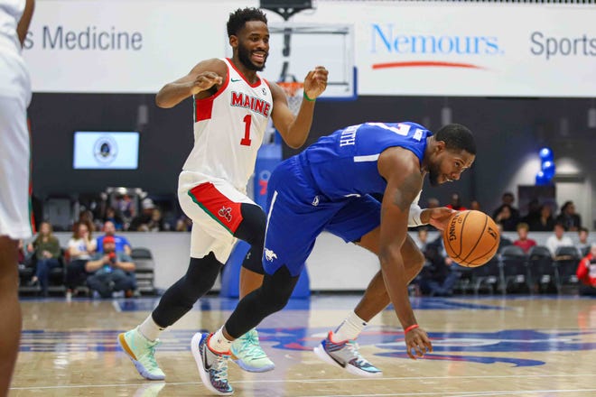 Delaware Bluecoats HAYWOOD HIGHSMITH (7) stumbles  as Maine Red Claws Forward YANTE MATEN (1) defends in the first half of a NBA G-League regular season basketball game between the Bluecoats and the Maine Red Claws (Boston Celtics) Saturday, Nov. 09, 2019, at the 76ers Fieldhouse in Wilmington, DE