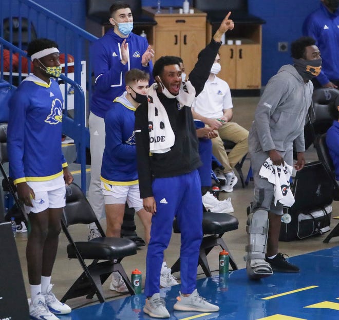 The Delaware bench celebrates as the Hens build a lead in the second half of their 74-56 win at the Bob Carpenter Center Friday, Jan. 15, 2021.