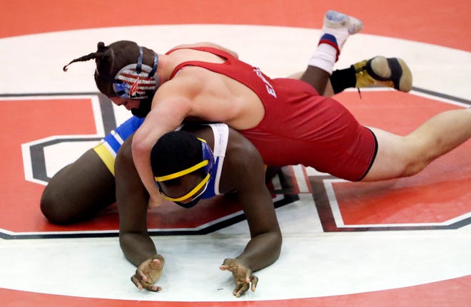 Smyrna's Tyler Downward works toward a win by pin at 195 pounds against Caesar Rodney's Shamar Nelson in Smyrna's 46-32 win Wednesday, Jan. 27, 2021.
