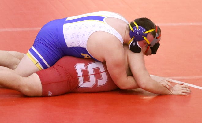 Caesar Rodney's Kevin Hudson (top) wrestles against Smyrna's Ryan Blair at 285 pounds before Hudson's win by pin in Smyrna's 46-32 win Wednesday, Jan. 27, 2021.