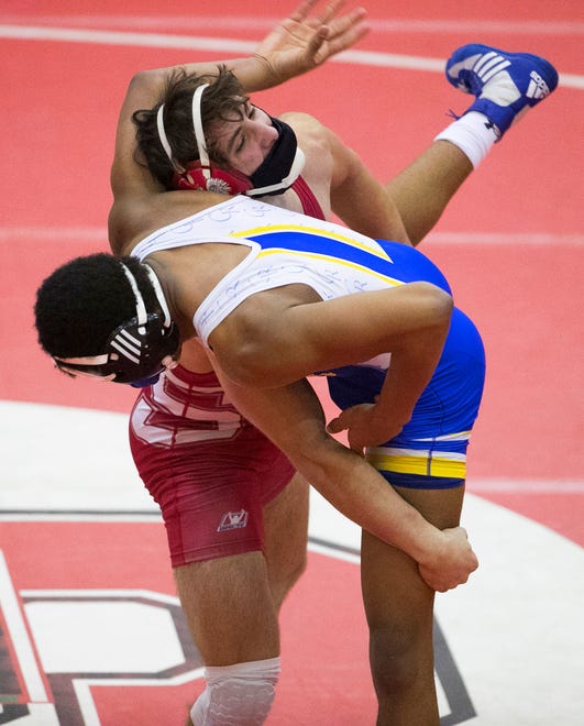 Smyrna's Nathan Lesniczak (top) wins by pin at 170 pounds against Caesar Rodney's DeVaughn Baker in Smyrna's 46-32 win Wednesday, Jan. 27, 2021.