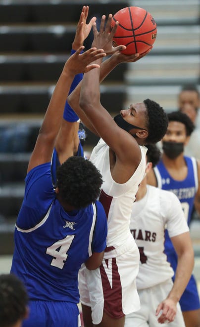 Appoquinimink's Charles Bedwell drives as Middletown's Amir Cunningham defends in the Jaguars' 50-46 win at home Thursday, Jan. 28, 2021.