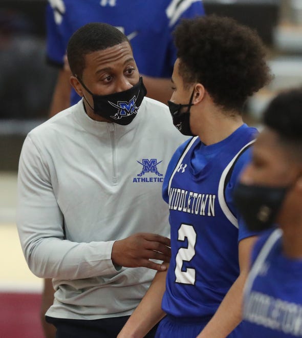 Middletown head coach Azeez Ali gives instruction to Christion Simms in the Jaguars' 50-46 win at home Thursday, Jan. 28, 2021.