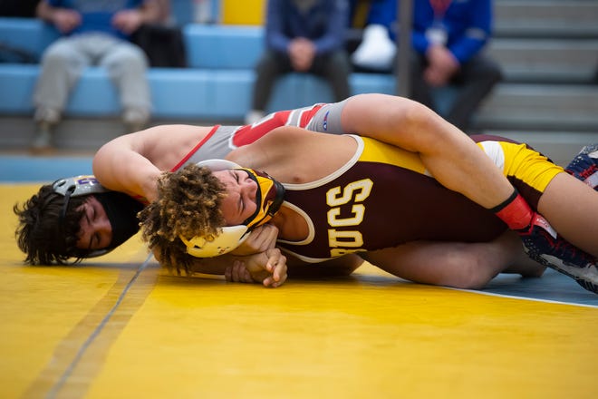Smyrna's Gabe Giampietro (left) and Milford's Trevor Copes wrestle in the 113 pound championship match at the DIAA State Individual Wrestling Championship at Cape Henlopen High School Wednesday, March 3, 2021.