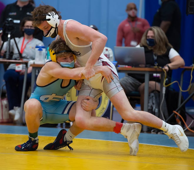 Cape HenlopenÕs Charles Fritchman (left)and CaravelÕs Alex Poore wrestle in the 152 pound championship match at the DIAA State Individual Wrestling Championship at Cape Henlopen High School Wednesday, March 3, 2021.