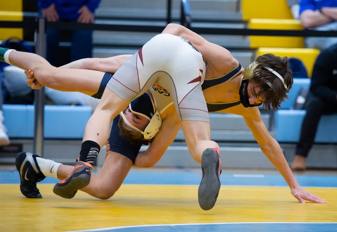 Salesianum's Chris Gandolfo (right) and Caravel's Eddie Radecki wrestle in the 106 pound championship match at the DIAA State Individual Wrestling Championship at Cape Henlopen High School Wednesday, March 3, 2021.