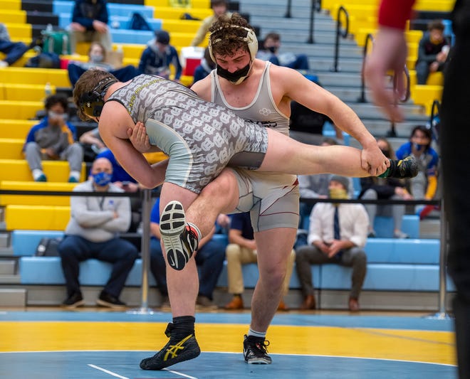 Caravel's Danny Stradley (right) and Cape Henlopen's Jackson Handlin wrestle in the 195 pound championship match at the DIAA State Individual Wrestling Championship at Cape Henlopen High School Wednesday, March 3, 2021.