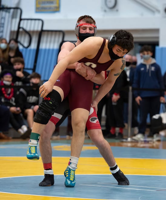 Smyrna's Joey Natarcola (rear) and Caravel's Nick Hall wrestle in the 160 pound championship match at the DIAA State Individual Wrestling Championship at Cape Henlopen High School Wednesday, March 3, 2021.