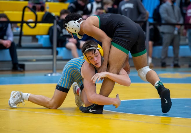 Cape HenlopenÕs Luke Bender (left) and St. Georges Jonathan Carrion wrestle in the 145 pound championship match at the DIAA State Individual Wrestling Championship at Cape Henlopen High School Wednesday, March 3, 2021.