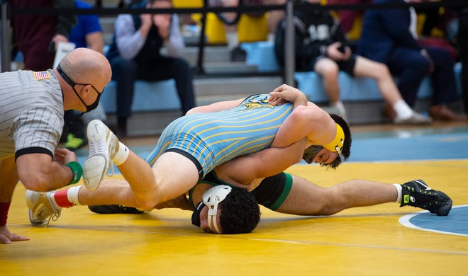 Cape Henlopen's Luke Bender (top) and St. Georges Jonathan Carrion wrestle in the 145 pound championship match at the DIAA State Individual Wrestling Championship at Cape Henlopen High School Wednesday, March 3, 2021.