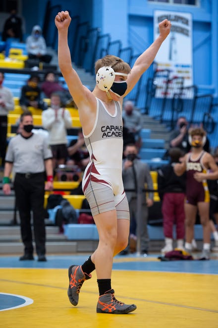 CaravelÕs Eddie Radecki celebrates after defeating SalesianumÕs Chris Gandolfo in the 106 pound championship match at the DIAA State Individual Wrestling Championship at Cape Henlopen High School Wednesday, March 3, 2021.