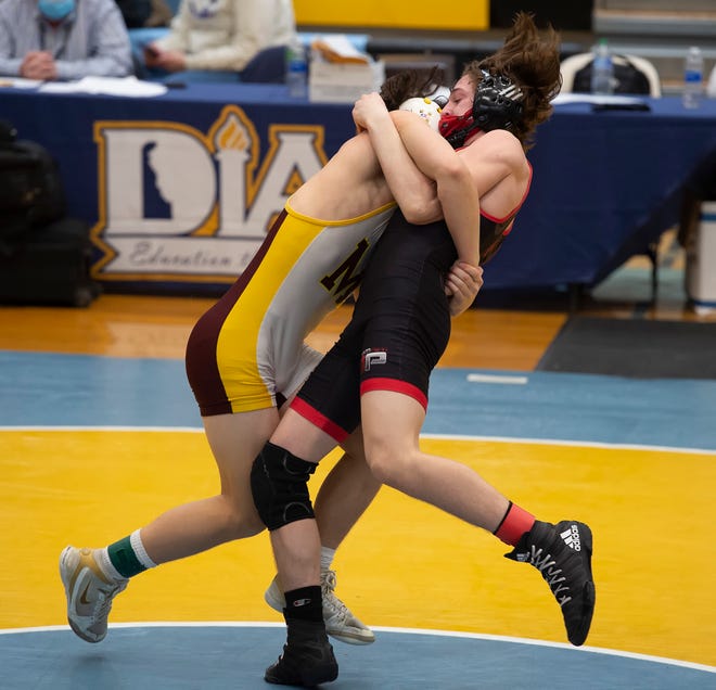 William Penn's Danny Sinclair (right)  and Milford's Trent Grant wrestle in the 132 pound championship match at the DIAA State Individual Wrestling Championship at Cape Henlopen High School Wednesday, March 3, 2021.