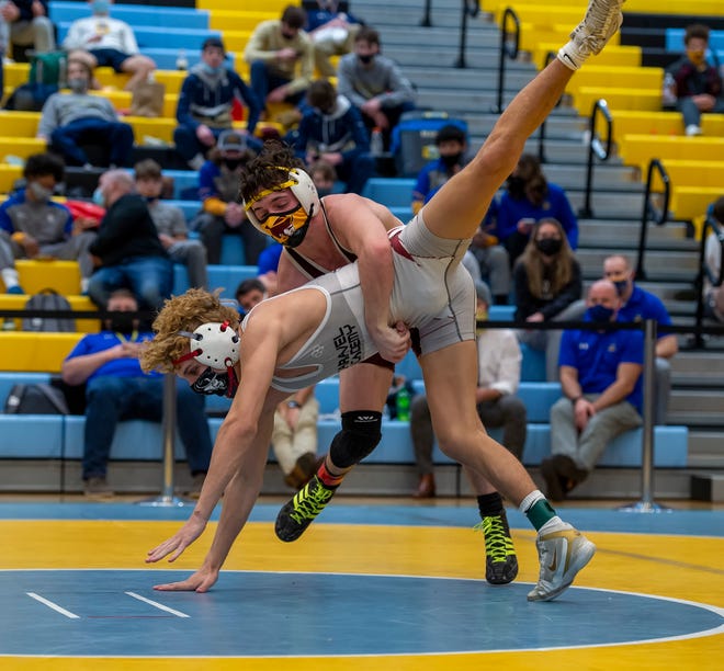 CaravelÕs Dylan Knight (front) and MilfordÕs Jack Thode wrestle in the 126 pound championship match at the DIAA State Individual Wrestling Championship at Cape Henlopen High School Wednesday, March 3, 2021.