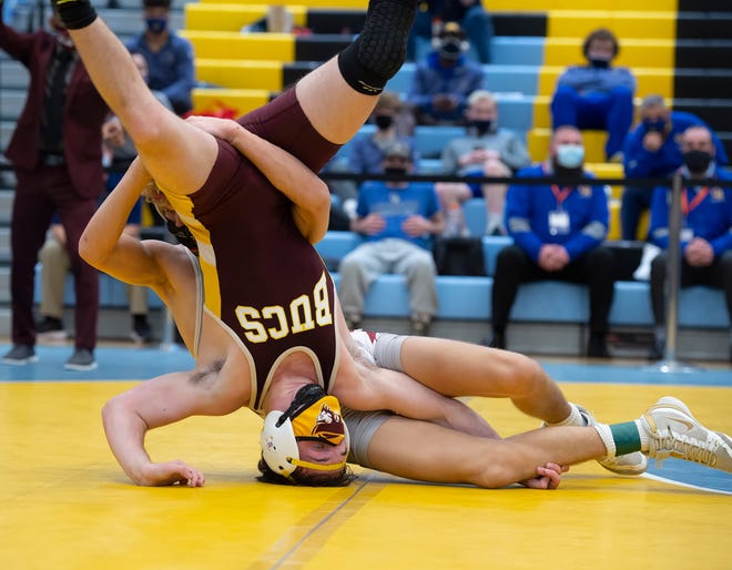 Caravel's Dylan Knight (rear) and Milford's Jack Thode wrestle in the 126 pound championship match at the DIAA State Individual Wrestling Championship at Cape Henlopen High School Wednesday, March 3, 2021.