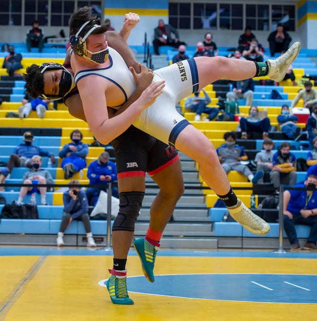 William Penn's Nasir Dreuitt (left) and Sanford's Jason Lamey wrestle in the 220 pound championship match at the DIAA State Individual Wrestling Championship at Cape Henlopen High School Wednesday, March 3, 2021.