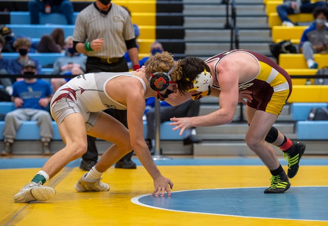 CaravelÕs Dylan Knight (left) and MilfordÕs Jack Thode wrestle in the 126 pound championship match at the DIAA State Individual Wrestling Championship at Cape Henlopen High School Wednesday, March 3, 2021.