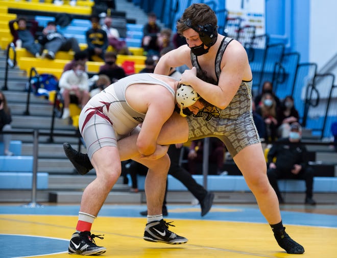 CaravelÕs Danny Stradley (left) and Cape HenlopenÕs Jackson Handlin wrestle in the 195 pound championship match at the DIAA State Individual Wrestling Championship at Cape Henlopen High School Wednesday, March 3, 2021.
