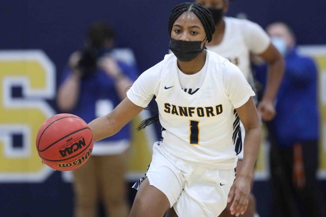 Sanford Guard Azareya Kilgoe (1) handles the ball during a DIAA semifinal Wednesday, Mar. 10, 2021 at Sanford School.