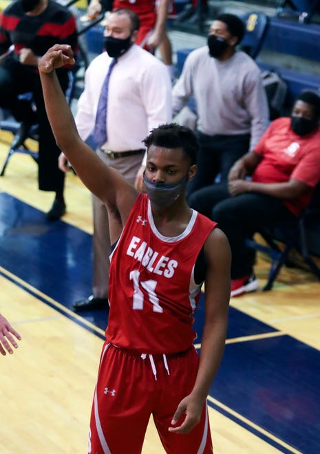 Smyrna's Majesti Carter hits a three-pointer to give his team a 42-40 lead in the final minute of the Eagles' 43-42 win in a semifinal of the DIAA state tournament at Salesianum Thursday, March 11, 2021.