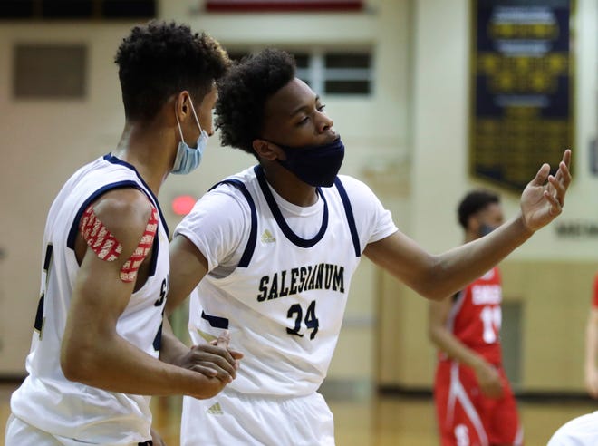 Salesianum's Dariyon Williams (24) reacts to a foul call as Ethan Hinds looks on in the Eagles' 43-42 win in a semifinal of the DIAA state tournament at Salesianum Thursday, March 11, 2021.