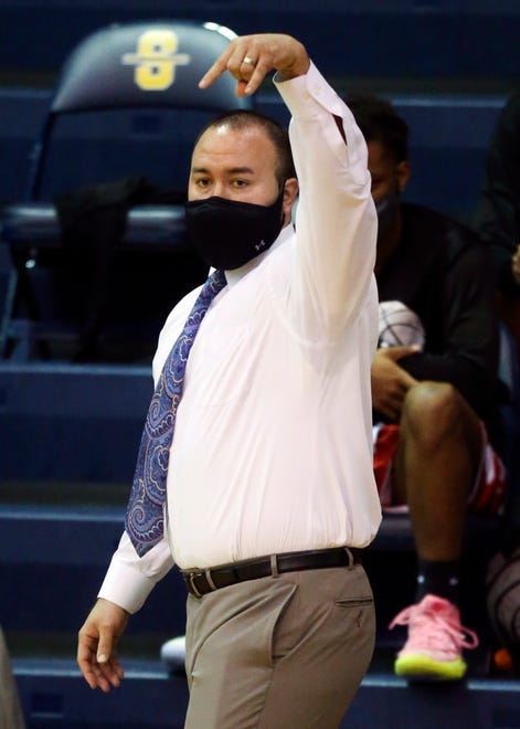 Smyrna head coach Andrew Mears gestures to his team in the Eagles' 43-42 win in a semifinal of the DIAA state tournament at Salesianum Thursday, March 11, 2021.