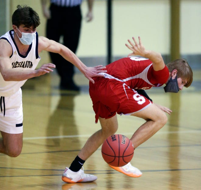 Salesianum's Brett O'Hara (left) and Smyrna's Cole Matthews turn for a loose ball in the Eagles' 43-42 win in a semifinal of the DIAA state tournament at Salesianum Thursday, March 11, 2021.